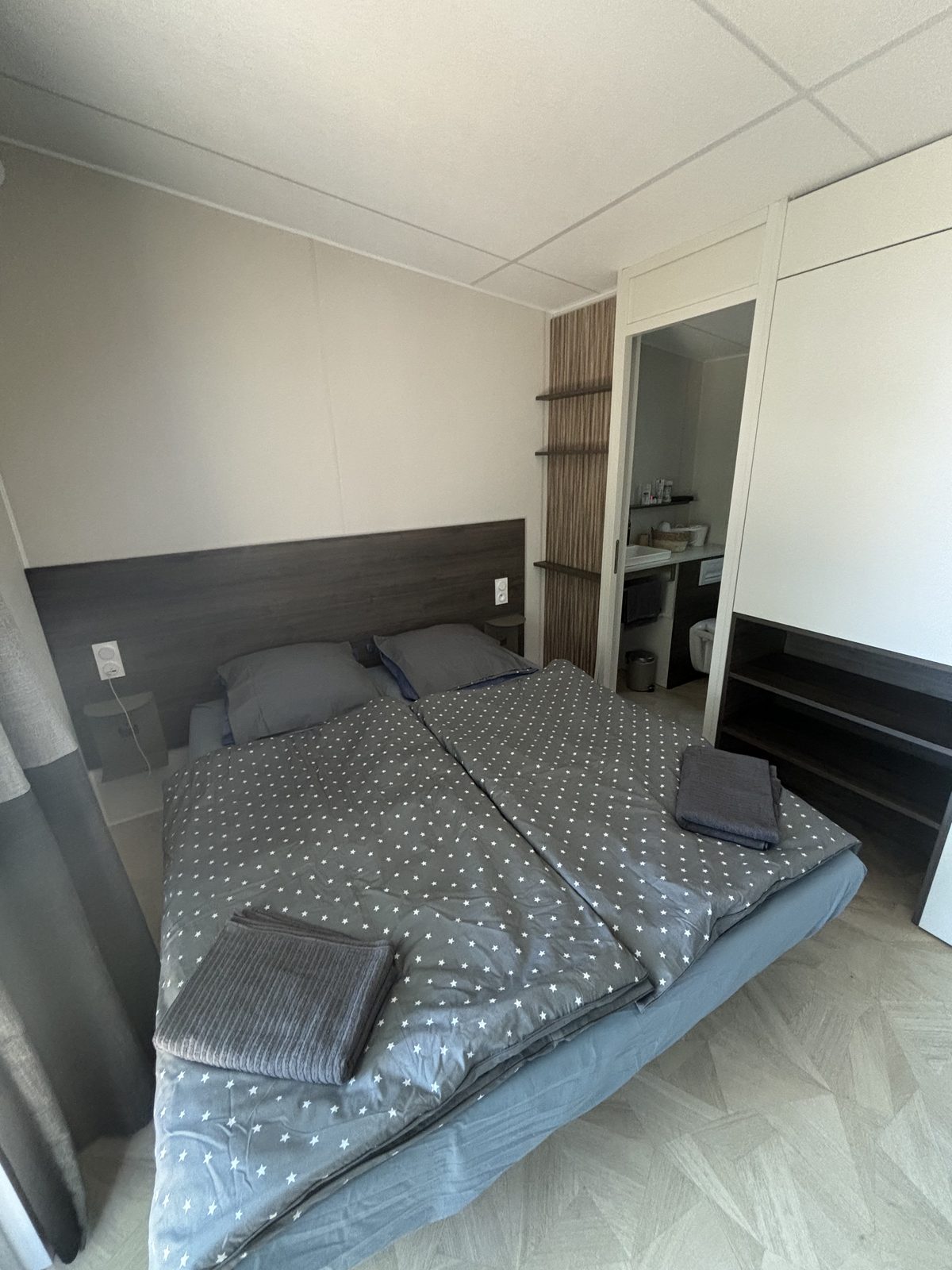Master bedroom with king-size bed and en-suite beyond